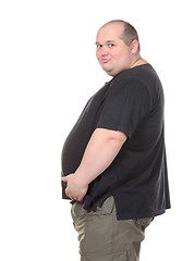 Image showing Fat Man Standing in Profile and Holding her Belly