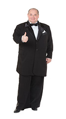 Image showing Elegant fat man in a tuxedo shows thumb-up