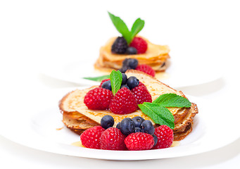 Image showing Delicious Freshly Prepared Pancakes with Honey and Berries