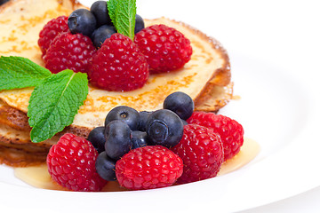 Image showing Delicious Freshly Prepared Pancakes with Honey and Berries