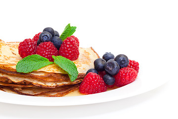 Image showing Delicious Freshly Prepared Pancakes with Honey and Berries