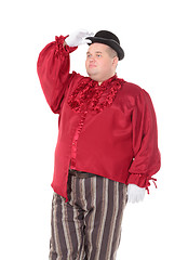 Image showing Obese man in a red costume and bowler hat