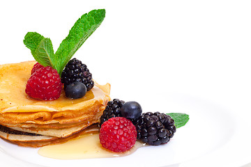 Image showing Delicious Freshly Prepared Pancakes with Honey and Berries