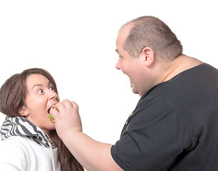 Image showing Fat Man Feeding a Girl a Burger