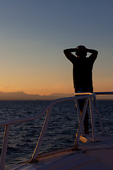 Image showing Person enjoying an ocean sunset