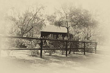 Image showing Sepia Wooden Dollhouse in Garden