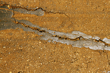 Image showing Close-Up Rural Road Surface Cracks and Breaking Up