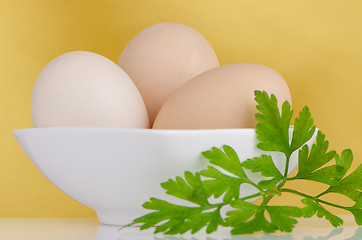 Image showing Three eggs in the bowl 