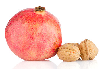 Image showing Ripe pomegranate fruit and nuts