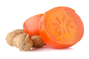 Image showing Ripe persimmons and nuts