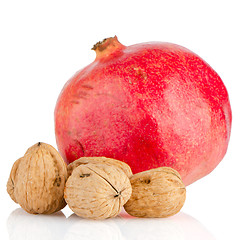 Image showing Ripe pomegranate fruit and nuts