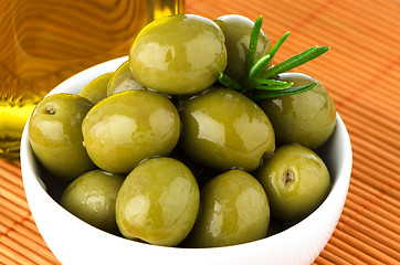 Image showing Green olives in a white ceramic bowl