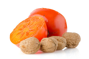 Image showing Ripe persimmons and nuts