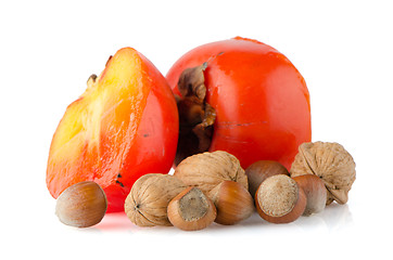 Image showing Ripe persimmons and nuts