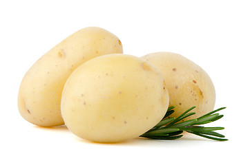 Image showing New potatoes and green herbs