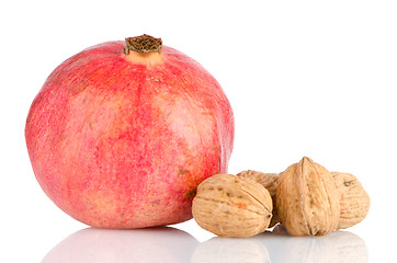 Image showing Ripe pomegranate fruit and nuts