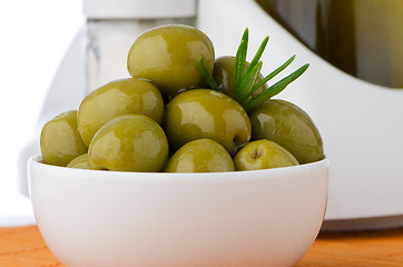 Image showing Green olives in a white ceramic bowl