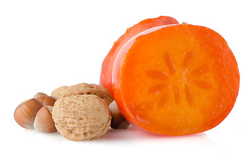 Image showing Ripe persimmons and nuts