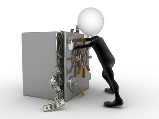 Image showing Businessman trying to close a security box full of money