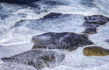 Image showing ocean waves crashing on rocks