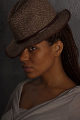 Image showing dark portrait of a girl in hat