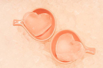 Image showing Heart ice in pink cups with ice texture background