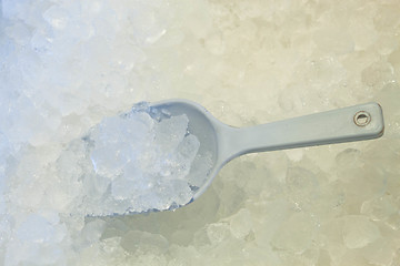 Image showing Ice scoop in fresh cool ice background 