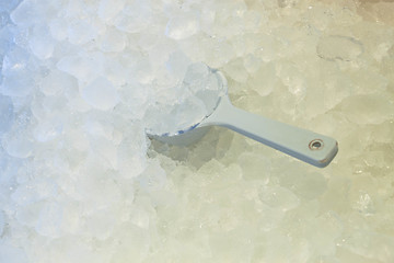 Image showing Ice spoon in fresh cool ice background 