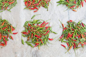 Image showing Lots of spicy red and green hot chili peppers 