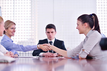 Image showing business people making a deal at meeting