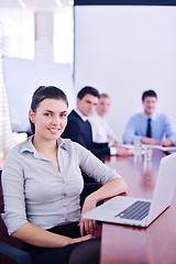 Image showing business woman with her staff in background at office