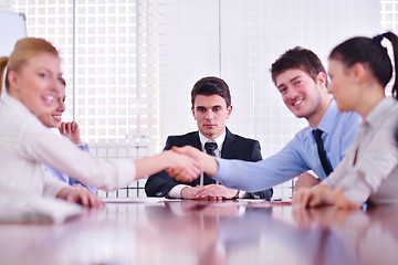 Image showing business people making a deal at meeting