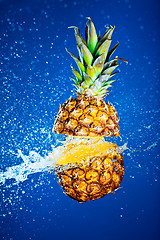 Image showing Pineapple splashed with water
