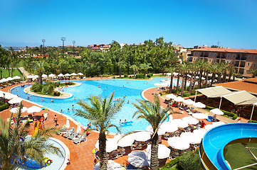 Image showing People on rest near swimming pool