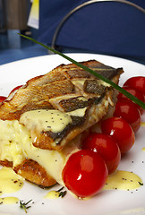 Image showing Fish with tomatoes and a potato
