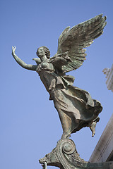 Image showing Bronze Angel against blue sky