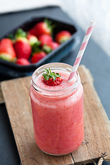 Image showing Fruit smoothie and strawberries