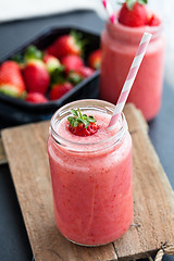 Image showing Fruit smoothie and strawberries