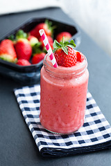 Image showing Fruit smoothie and strawberries