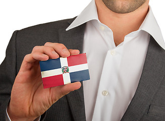 Image showing Businessman is holding a business card, The Dominican Republic