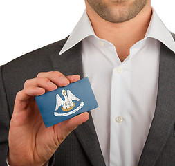 Image showing Businessman is holding a business card, Louisiana