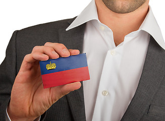 Image showing Businessman is holding a business card, Liechtenstein