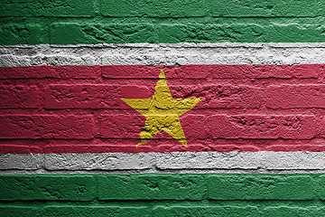 Image showing Brick wall with a painting of a flag, Suriname