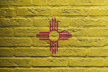 Image showing Brick wall with a painting of a flag, New Mexico