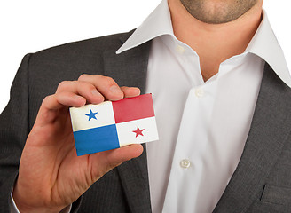 Image showing Businessman is holding a business card, Panama