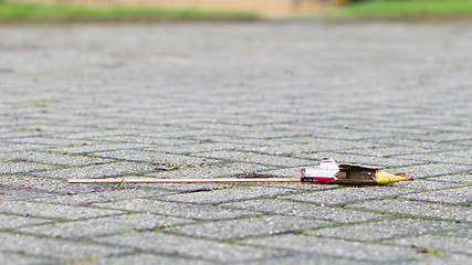 Image showing Burnt-out rocket on the streets