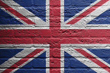 Image showing Brick wall with a painting of a flag