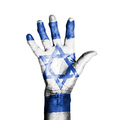 Image showing Hand of an old woman, wrapped with a pattern of the flag of Isra