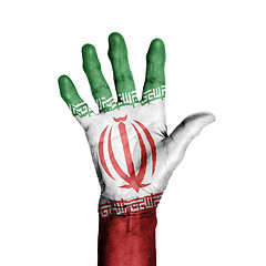 Image showing Hand of an old woman, wrapped with a pattern of the flag of Iran