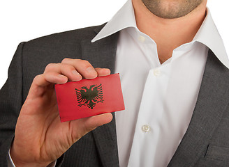 Image showing Businessman is holding a business card, Albania